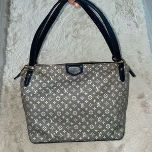 Authentic Louis Vuitton navy blue denim bag preowned.